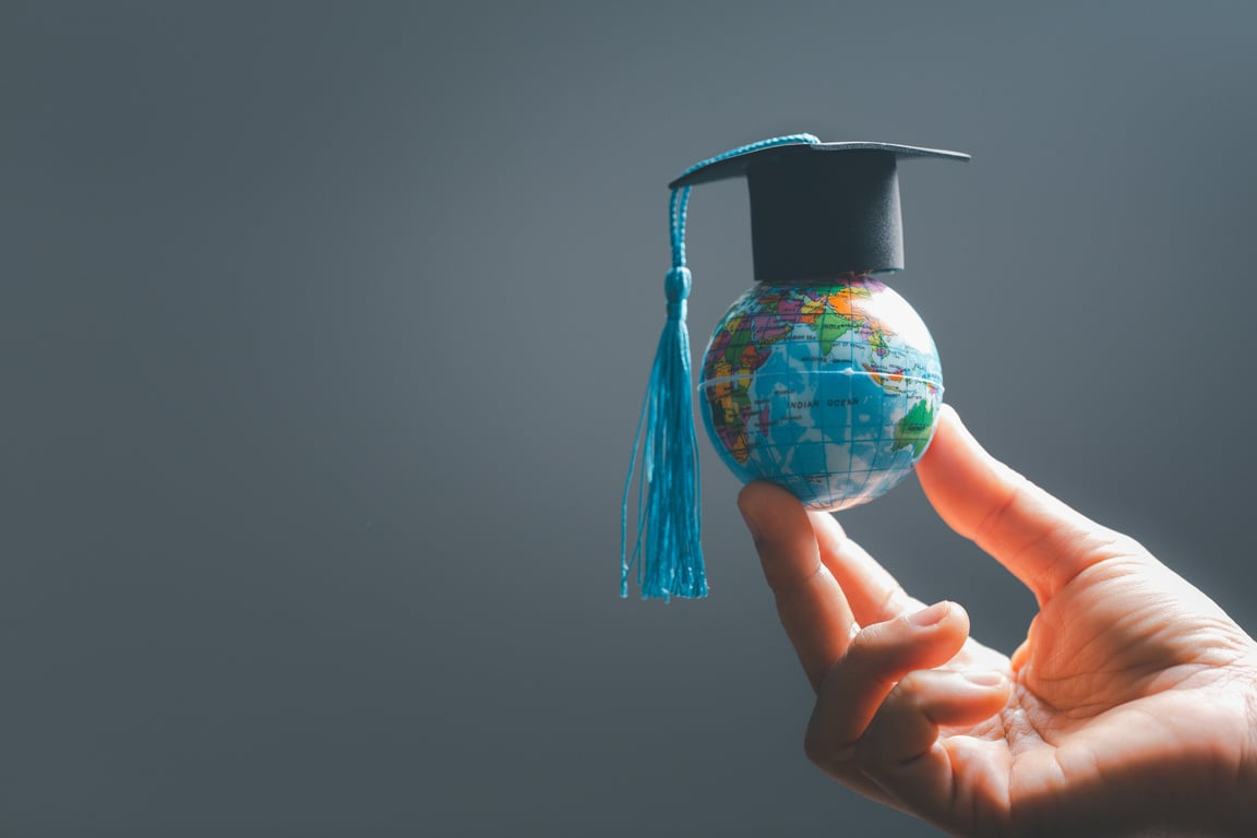 Graduation cap with Earth globe. Concept of global business study, abroad educational, Back to School. Education in Global world, Study abroad business in universities in worldwide. language study